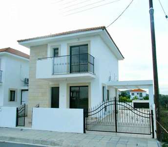 Elegant two-storey residence, boasting a refined architectural style, with distinguished stone accents adorning the facade