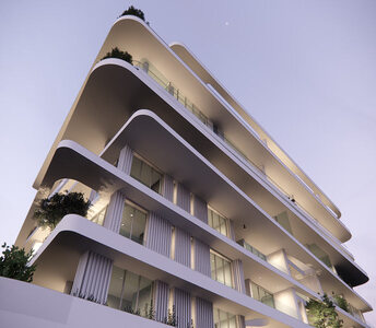 Архитектурно выразительное здание с апартаментами в районе Като Пафос с изогнутыми террасами и панорамными окнами