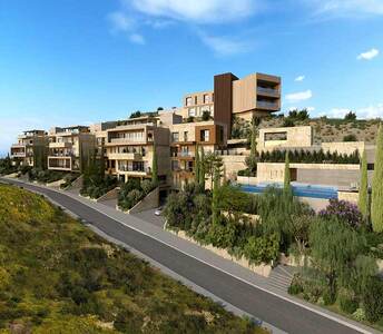 Tiered blocks of flats in Agios Tychonas with stone façades, lush landscaping and panoramic sea orientation