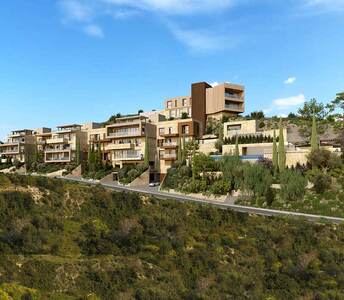 Architectural composition of tiered properties with stone textures and vertical volumes, set against native hillside vegetation