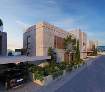 Rear view of apartment buildings with decorative stone cladding, geometric architectural lines and access from a private road