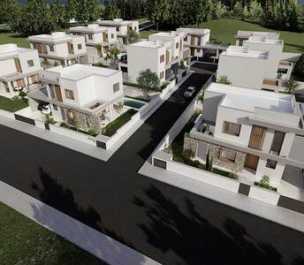 Aerial view of residential development in Souni, Limassol, featuring modern detached villas with private gardens and tree-lined surroundings.