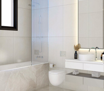 Bathroom with built-in bathtub, glass partition, and floating vanity unit with backlit mirror