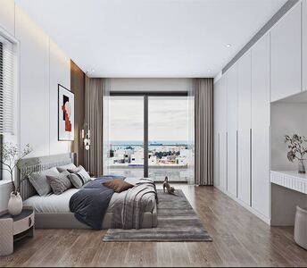Master bedroom of the penthouse with built-in wardrobes and large windows offering panoramic views